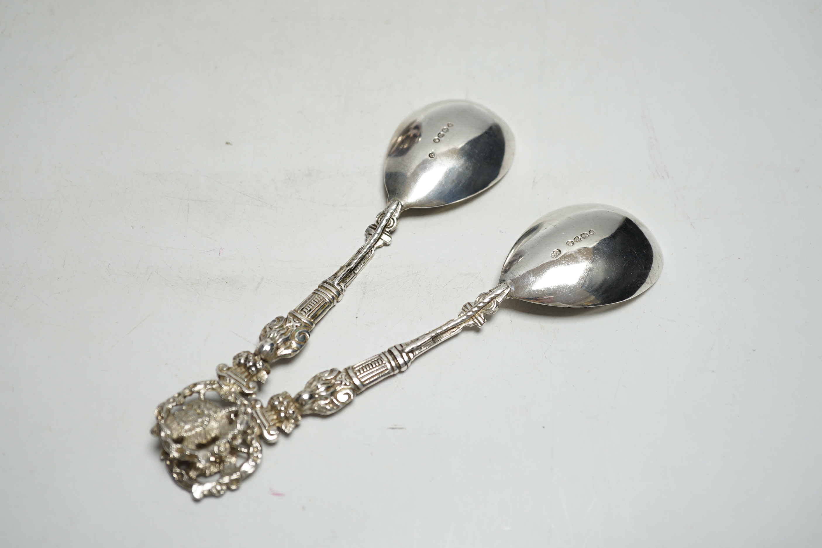 A pair of Victorian silver serving spoons, with figural handles and phoenix terminals, Charles Boyton, London, 1882, 18.9cm, 4.2oz.
